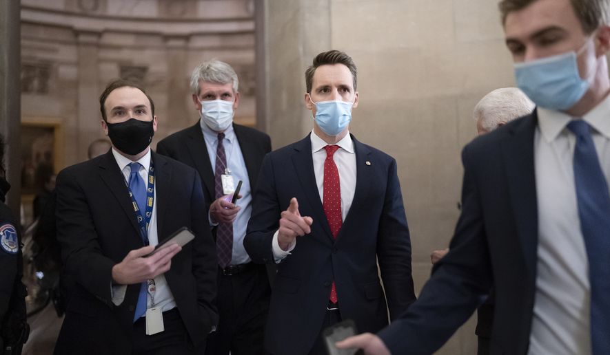 After violent protesters loyal to President Donald Trump stormed the U.S. Capitol today, Sen. Josh Hawley, R-Mo., walks to the House chamber to challenge the results of the presidential election in Pennsylvania during the joint session of the House and Senate to count the Electoral College votes cast in November&#x27;s election, at the Capitol in Washington, Wednesday, Jan. 6, 2021. (AP Photo/J. Scott Applewhite)