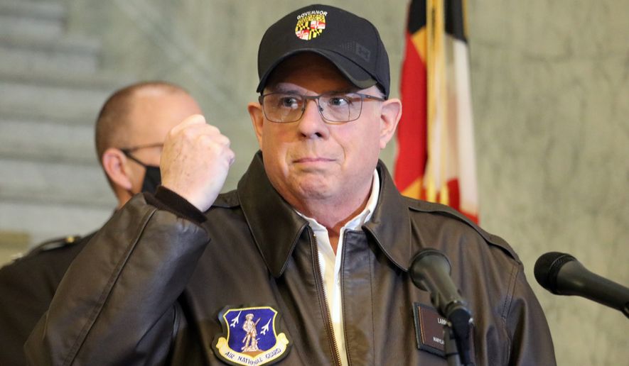 Maryland Gov. Larry Hogan holds his hand up during a news conference in Annapolis, Md., on Thursday, Jan. 7, 2021, as he describes phone conversations he had with Maryland Rep. Steny Hoyer and Secretary of the Army Ryan McCarthy on sending Maryland National Guard members to help protect the U.S. Capitol after rioters stormed the building a day earlier. (AP Photo/Brian Witte)