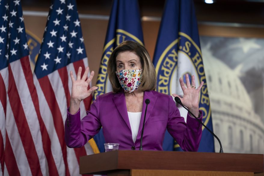 Speaker of the House Nancy Pelosi, D-Calif., holds a news conference on the day after violent protesters loyal to President Donald Trump stormed the U.S. Congress, at the Capitol in Washington, Thursday, Jan. 7, 2021. (AP Photo/J. Scott Applewhite)