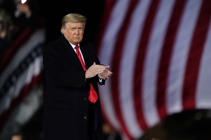 President Donald Trump speaks at a campaign rally in support of Senate candidates Sen. Kelly Loeffler, R-Ga., and David Perdue in Dalton, Ga., Monday, Jan. 4, 2021. (AP Photo/Brynn Anderson)
