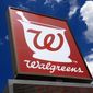 This June 25, 2019, file photo shows a sign outside a Walgreens Pharmacy in Pittsburgh.  On Thursday, Jan. 7, 2021, Walgreens Boots Alliance lost $308 million in its first fiscal quarter due to a big charge tied to its ownership stake in the drug wholesaler AmerisourceBergen. The drugstore chain also saw COVID-19 continue to eat away at its business, particularly in the United Kingdom, but the company’s overall performance topped Wall Street expectations.   (AP Photo/Gene J. Puskar, File)