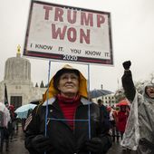 A supporter of President Donald Trump gathers to protest in solidarity on Wednesday, Jan. 6, 2021 in Salem, Ore. Thousands of President Donald Trump&#x27;s supporters caused violence and chaos in Washington while Congress attempted to vote to certify that President-elect Joe Biden won the election. (AP Photo/Paula Bronstein)