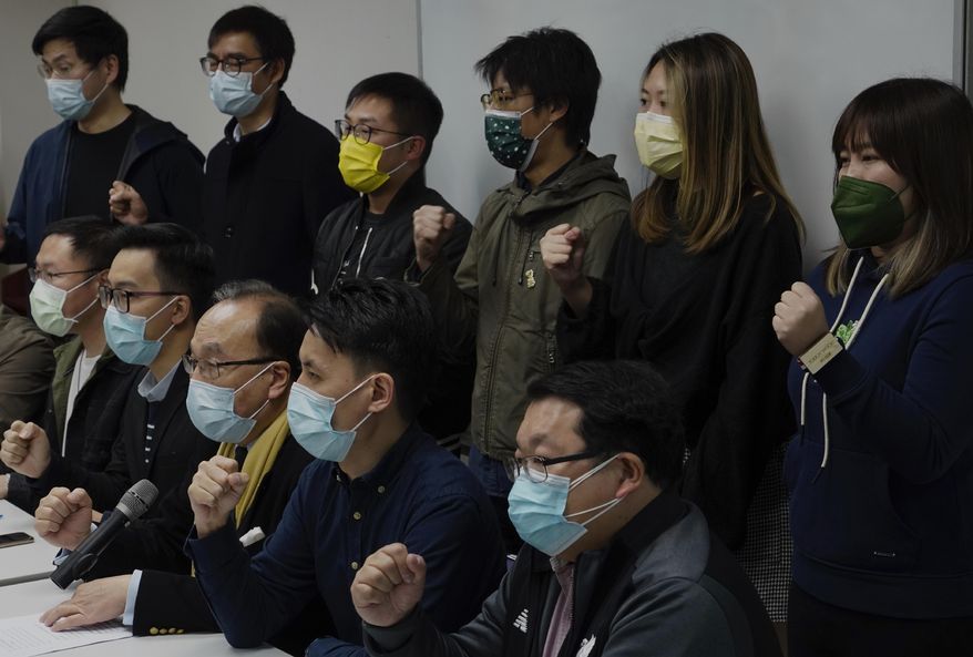 Pro-democratic party members shout slogans in response to the mass arrests during a press conference in Hong Kong Wednesday, Jan. 6, 2021. About 50 Hong Kong pro-democracy figures were arrested by police on Wednesday under a national security law, following their involvement in an unofficial primary election last year held to increase their chances of controlling the legislature, according to local media reports. (AP Photo/Vincent Yu)