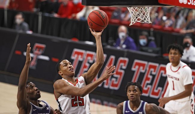 Texas Tech&#x27;s Nimari Burnett (25) lays up the shot during the second half of an NCAA college basketball game against Kansas State, Tuesday, Jan. 5, 2021, in Lubbock, Texas. (AP Photo/Brad Tollefson)