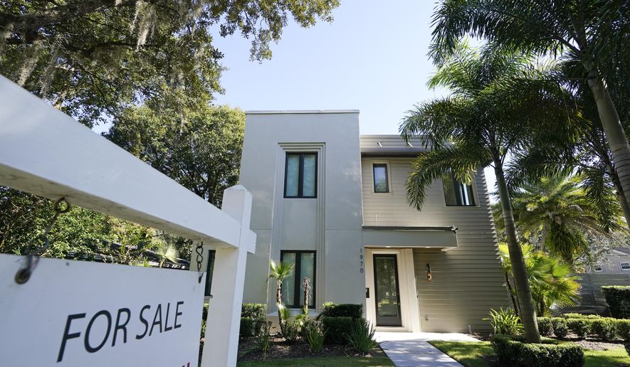 A home for sale is seen Tuesday, Dec. 8, 2020, in Orlando, Fla. U.S. long-term mortgage rates declined this week to new record lows for the first week of 2021. The year opens against the continuing backdrop of damage from the coronavirus pandemic on the U.S. and global economies, which suppressed home loan rates through most of 2020. (AP Photo/John Raoux)