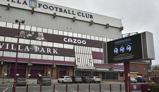 FILE - This Saturday, Nov. 21, 2020 file photo shows a general view of a social distancing message on display outside the Villa Park stadium, home of Aston Villa, in Birmingham, England. Aston Villa has on Thursday, Jan. 7, 2021 reported a “significant” coronavirus outbreak and closed its training ground a day before a scheduled FA Cup home game against Liverpool. Villa says “discussions are ongoing between medical representatives of the club, the Football Association and the Premier League.” (AP Photo/Rui Vieira, file)
