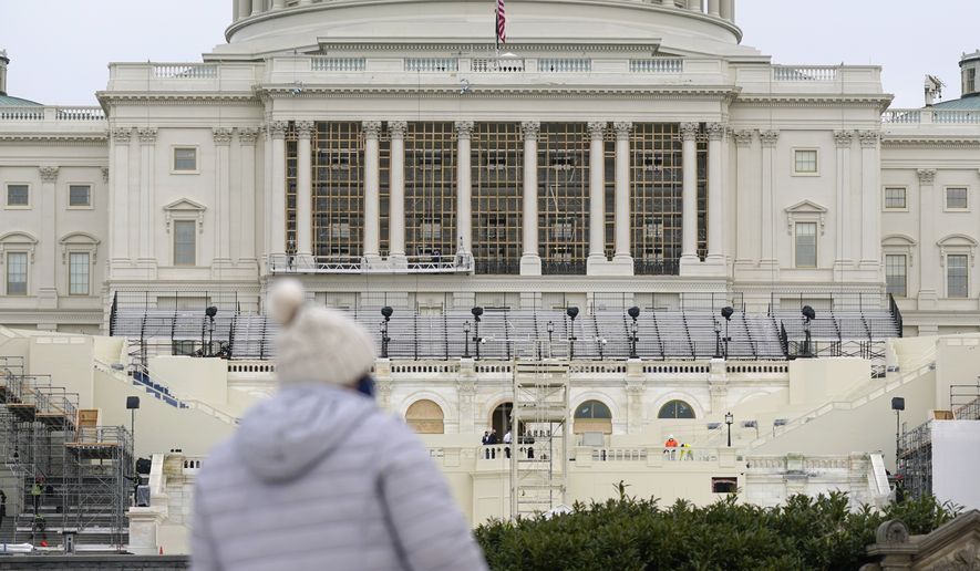 Preparations take place for President-elect Joe Biden&#39;s inauguration on the West Front of the U.S. Capitol in Washington, Friday, Jan. 8, 2021, after supporters of President Donald Trump stormed the building. (AP Photo/Patrick Semansky)