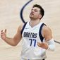 Dallas Mavericks guard Luka Doncic reacts to a missed shot against the Denver Nuggets during the second quarter of an NBA basketball game Thursday, Jan. 7, 2021, in Denver. (AP Photo/Jack Dempsey)