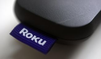 This Aug. 13, 2020 file photo shows a logo for Roku on a remote control in Portland, Ore. (AP Photo/Jenny Kane, File)
