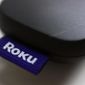 FILE - This Aug. 13, 2020 file photo shows a logo for Roku on a remote control in Portland, Ore.  On Friday, Jan. 8, 2021, Roku is buying short-lived streaming service Quibi’s content library to bolster content for its free Roku Channel. Financial terms were undisclosed.  AP Photo/Jenny Kane, File)