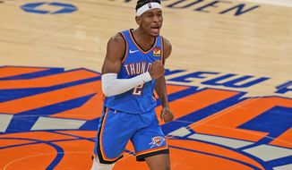 Oklahoma City Thunder&#39;s Shai Gilgeous-Alexander reacts after sinking a basket during the second half of an NBA basketball game against the New York Knicks, Friday, Jan. 8, 2021, in New York. (AP Photo/Seth Wenig, Pool)