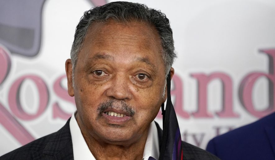 Rev. Jesse Jackson speaks Friday, Jan. 8, 2021, before receiving the Pfizer&#x27;s BioNTech COVID-19 vaccine at the Roseland Community Hospital in Chicago. (AP Photo/Charles Rex Arbogast)