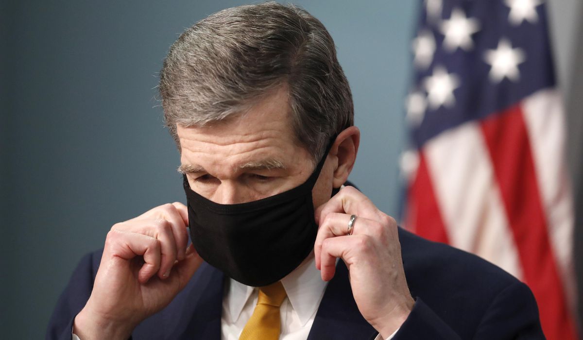 NextImg:Once required, masks are shifting from being mandated to being criminalized in some states