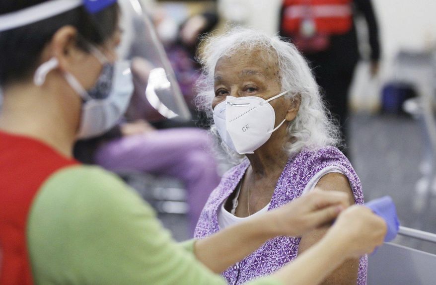 Fledra Hatch awaits her Moderna COVID-19 vaccine at the Durham County Department of Public Health in Durham, N.C., on Friday, Jan. 8, 2021. (Julia Wall/The News & Observer via AP)