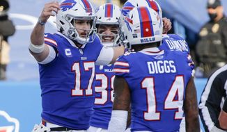 Buffalo Bills&#x27; Josh Allen (17) celebrates with teammate Stefon Diggs (14) after scoring a touchdown during the first half of an NFL wild-card playoff football game against the Indianapolis Colts Saturday, Jan. 9, 2021, in Orchard Park, N.Y. (AP Photo/Jeffrey T. Barnes)