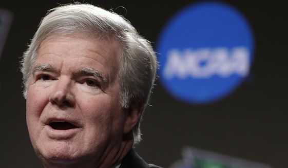 In this April 4, 2019, file photo, NCAA President Mark Emmert answers questions during a news conference at the Final Four college basketball tournament in Minneapolis. The NCAA is set to delay a potential landmark vote on legislation that would permit college athletes to be compensated for their fame for the first time after the association received a warning from the Department of Justice about potential antitrust violations. NCAA President Mark Emmert on Saturday, Jan. 9, 2020, emailed a letter to Makan Delrahim, assistant attorney general of the DOJ&#39;s antitrust division, saying he strongly recommended putting off votes on new name, image and likeness rules by two key legislative bodies that had been scheduled for next week. (AP Photo/Matt York, File) **FILE**