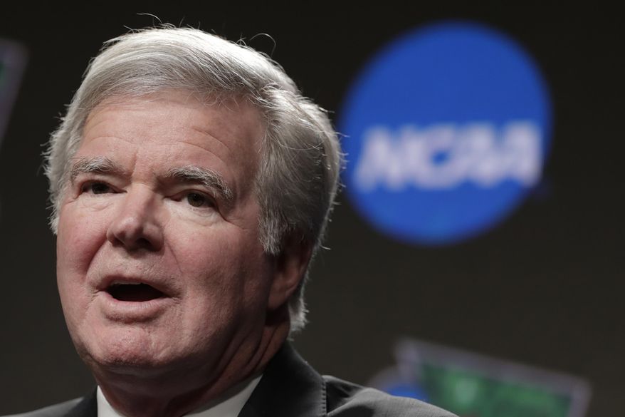 In this April 4, 2019, file photo, NCAA President Mark Emmert answers questions during a news conference at the Final Four college basketball tournament in Minneapolis. The NCAA is set to delay a potential landmark vote on legislation that would permit college athletes to be compensated for their fame for the first time after the association received a warning from the Department of Justice about potential antitrust violations. NCAA President Mark Emmert on Saturday, Jan. 9, 2020, emailed a letter to Makan Delrahim, assistant attorney general of the DOJ&#39;s antitrust division, saying he strongly recommended putting off votes on new name, image and likeness rules by two key legislative bodies that had been scheduled for next week. (AP Photo/Matt York, File) **FILE**
