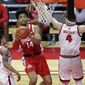 Ohio State forward Justice Sueing (14) drives to the basket past Rutgers guard Paul Mulcahy during the second half of an NCAA college basketball game Saturday, Jan. 9, 2021, in Piscataway, N.J. Ohio State won 79-68. (AP Photo/Adam Hunger)