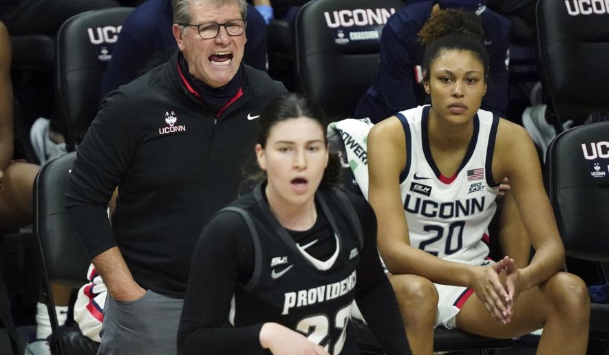 Connecticut head coach Geno Auriemma shouts from the sideline during the first half of an NCAA college basketball game against Providence at Harry A. Gampel Pavilion, Saturday, Jan. 9, 2021, in Storrs, Conn. (David Butler II/Pool Photo via AP)