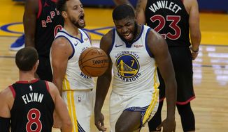 Golden State Warriors forward Eric Paschall (7) celebrates after scoring against the Toronto Raptors with guard Stephen Curry during the second half of an NBA basketball game in San Francisco, Sunday, Jan. 10, 2021. (AP Photo/Jeff Chiu)