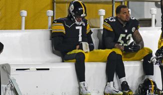Pittsburgh Steelers quarterback Ben Roethlisberger (7) sits on the bench next to center Maurkice Pouncey (53) following a 48-37 loss to the Cleveland Browns in an NFL wild-card playoff football game in Pittsburgh, Sunday, Jan. 10, 2021. (AP Photo/Don Wright)