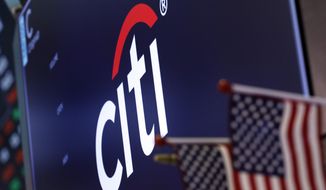 FILE - In this Feb. 8, 2019, file photo, the logo for Citigroup appears above a trading post on the floor of the New York Stock Exchange. Businesses are rethinking political contributions in the wake of the deadly Capitol siege by President Donald Trump’s supporters on Wednesday, Jan. 6, 2021. Citigroup confirmed Sunday, Jan. 10, 2021, that it is pausing all federal political donations for the first three months of the year.  (AP Photo/Richard Drew, File)