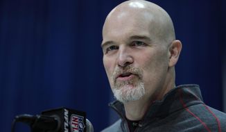 FILE - In this Feb. 25, 2020, file photo, Atlanta Falcons head coach Dan Quinn speaks during a press conference at the NFL football scouting combine in Indianapolis. The Dallas Cowboys agreed to terms Monday, Jan. 11, 2021, with former Atlanta coach Quinn as defensive coordinator, turning over a unit that was among the worst in franchise history to someone who built his reputation on defense in Seattle. (AP Photo/Michael Conroy, File)