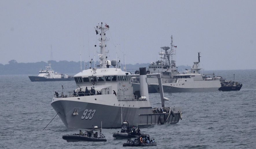 Indonesian Navy ships continue their search for the wreckage of Sriwijaya Air passenger jet that crashed into Java Sea near Jakarta, Indonesia, Monday, Jan. 11, 2021. Indonesian navy divers scoured the floor of the Java Sea on Monday as they hunted for the black boxes of a Sriwijaya Air jet that nosedived into the waters at high velocity with dozens of people aboard. (AP Photo/Tatan Syuflana)