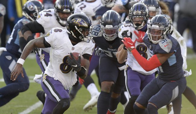 Baltimore Ravens quarterback Lamar Jackson (8) scrambles against the Tennessee Titans in the second half of an NFL wild-card playoff football game Sunday, Jan. 10, 2021, in Nashville, Tenn. The Ravens won 20-13. (AP Photo/Mark Zaleski)