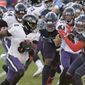 Baltimore Ravens quarterback Lamar Jackson (8) scrambles against the Tennessee Titans in the second half of an NFL wild-card playoff football game Sunday, Jan. 10, 2021, in Nashville, Tenn. The Ravens won 20-13. (AP Photo/Mark Zaleski)