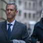 Israeli business man Beny Steinmetz, left, and his lawyer Marc Bonnant, right, arrive to a courthouse in Geneva, Switzerland, Monday, Jan. 11, 2021. Israeli diamond magnate Beny Steinmetz goes on trial in Geneva on charges of corruption and forging documents in connection with $10 million in bribes allegedly paid to a former wife of late Guinea President Lansana Conte. (Salvatore Di Nolfi/Keystone via AP)