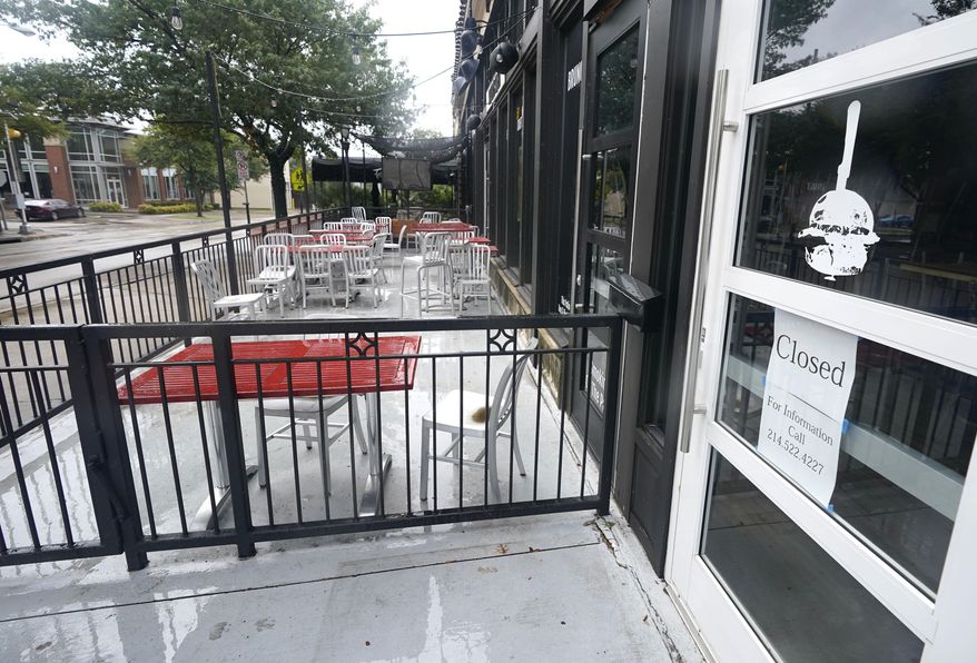 FILE - In this Sept. 2, 2020 file photo, a closed burger eatery sits empty in Dallas. The economic damage in Texas from the coronavirus pandemic has left a nearly $1 billion deficit in the state budget. The forecast by Texas Republican Comptroller Glenn Hegar on Monday, Jan. 11, 2021, reflects how the nation's energy capital remains hampered by a slow recovery and a half-million fewer jobs than a year ago. (AP Photo/LM Otero)