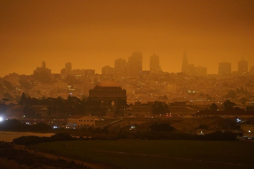 FILE - In this Sept. 9, 2020, file photo, the San Francisco skyline in the distance behind Crissy Field is barely visible due to smoke from wildfires burning across California. Researchers say smoke from wildfires accounted for up to half of all small particle air pollution in parts of the western U.S. in recent years (AP Photo/Eric Risberg, File)