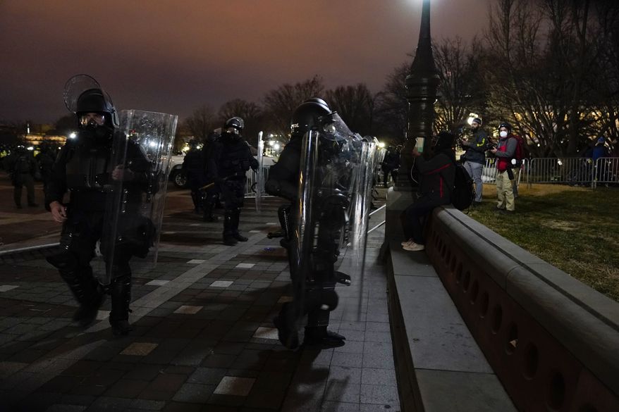 Authorities remove violent protesters from the U.S. Capitol, Wednesday, Jan. 6, 2021, in Washington. (AP Photo/Jacquelyn Martin) **FILE**