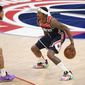Washington Wizards guard Bradley Beal (3) dribbles the ball against Phoenix Suns guard Devin Booker (1) during the second half of an NBA basketball game, Monday, Jan. 11, 2021, in Washington. (AP Photo/Nick Wass) **FILE**
