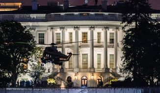 Marine One carrying President Donald Trump lands on the South Lawn at the White House, Tuesday, Jan. 12, 2021, in Washington. Trump toured a border wall in Alamo, Texas, a city in the Rio Grande Valley near the U.S.-Mexican border. (AP Photo/Manuel Balce Ceneta)