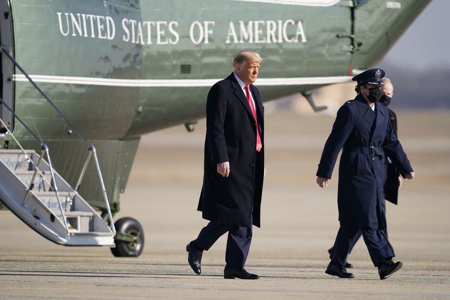President Donald Trump steps off Marine One before boarding Air Force One at Andrews Air Force Base, Md., for a trip to Texas, Tuesday, Jan. 12, 2021. (AP Photo/Manuel Balce Ceneta)