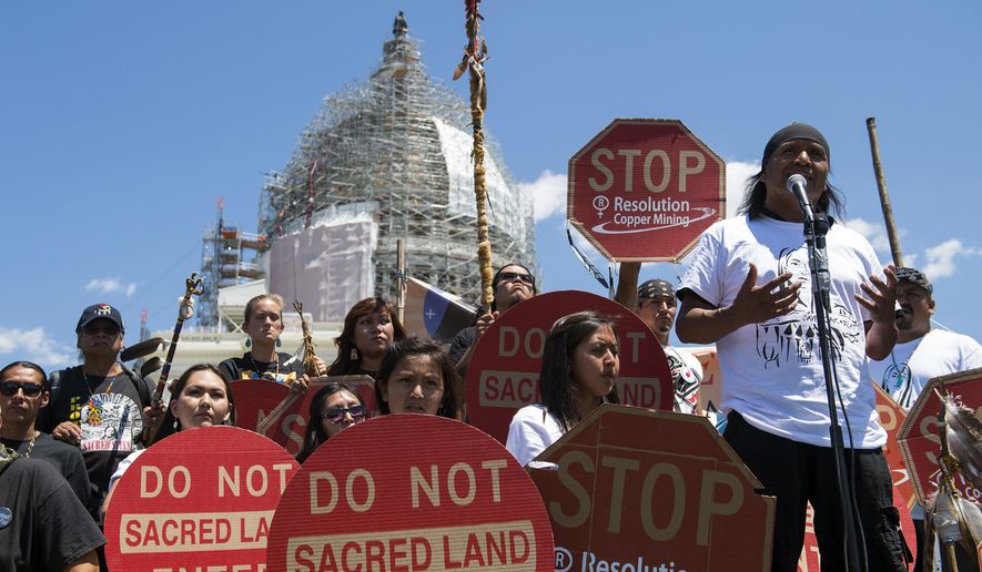 FILE - In this July 22, 2015, file photo, Tribal councilman Wendsler Nosie, Sr. speaks with Apache activists in a rally to save Oak Flat, land near Superior, Ariz., sacred to Western Apache tribes, in front of the U.S. Capitol in Washington. A group of Apaches who have tried for years to reverse a land swap in Arizona that will make way for one of the largest and deepest copper mines in the U.S. sued the federal government Tuesday, Jan. 12, 2021. Apache Stronghold argues in the lawsuit filed in U.S. District Court in Arizona that the U.S. Forest Service cannot legally transfer land to international mining company Rio Tinto in exchange for eight parcels the company owns around Arizona. (AP Photo/Molly Riley, File)
