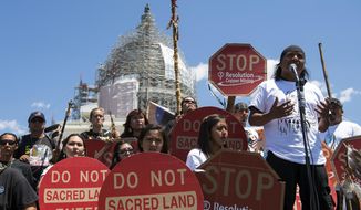 FILE - In this July 22, 2015, file photo, Tribal councilman Wendsler Nosie, Sr. speaks with Apache activists in a rally to save Oak Flat, land near Superior, Ariz., sacred to Western Apache tribes, in front of the U.S. Capitol in Washington. A group of Apaches who have tried for years to reverse a land swap in Arizona that will make way for one of the largest and deepest copper mines in the U.S. sued the federal government Tuesday, Jan. 12, 2021. Apache Stronghold argues in the lawsuit filed in U.S. District Court in Arizona that the U.S. Forest Service cannot legally transfer land to international mining company Rio Tinto in exchange for eight parcels the company owns around Arizona. (AP Photo/Molly Riley, File)