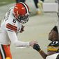 Cleveland Browns quarterback Baker Mayfield (6) greets Pittsburgh Steelers wide receiver JuJu Smith-Schuster (19) after defeating them in an NFL wild-card playoff football game, late Sunday, Jan. 10, 2021, in Pittsburgh. (AP Photo/Keith Srakocic)