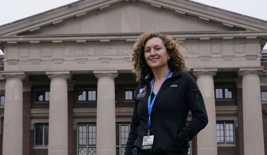 Dr. Daniela Lamas, a writer for the medical television drama "The Resident," poses outside the Brigham and Women's Hospital, Monday, Jan. 11, 2021, in Boston. The series kicks off its fourth season Tuesday with a pandemic storyline. (AP Photo/Charles Krupa)