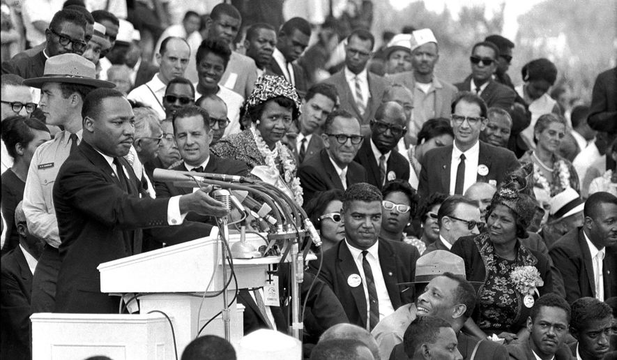 FILE - In this Aug. 28, 1963 file photo, the Rev. Dr. Martin Luther King Jr., head of the Southern Christian Leadership Conference, speaks to thousands during his &amp;quot;I Have a Dream&amp;quot; speech in front of the Lincoln Memorial for the March on Washington for Jobs and Freedom, in Washington. A new documentary “MLK/FBI,” shows how FBI director J. Edgar Hoover used the full force of his federal law enforcement agency to attack King and his progressive, nonviolent cause. That included wiretaps, blackmail and informers, trying to find dirt on King. (AP Photo/File)