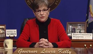 This computer screen capture from Kansas Gov. Laura Kelly&#39;s page on Facebook shows her giving the annual State of the State address, Tuesday, Kan., Tuesday, Jan. 12, 2021, in Topeka, Kan. Kelly says that given the recent mob violence in Washington, the state&#39;s leaders must &amp;quot;must commit ourselves to set an example&amp;quot; of working together. (AP Photo/John Hanna)