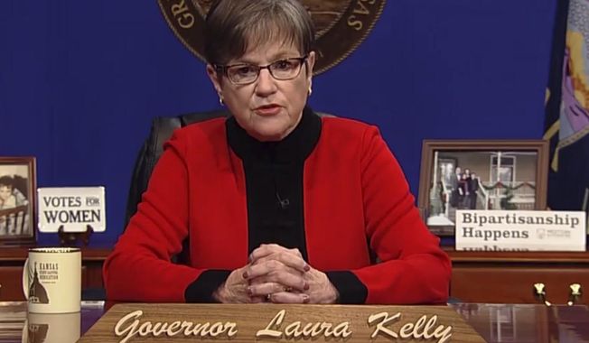 This computer screen capture from Kansas Gov. Laura Kelly&#x27;s page on Facebook shows her giving the annual State of the State address, Tuesday, Kan., Tuesday, Jan. 12, 2021, in Topeka, Kan. Kelly says that given the recent mob violence in Washington, the state&#x27;s leaders must &amp;quot;must commit ourselves to set an example&amp;quot; of working together. (AP Photo/John Hanna)