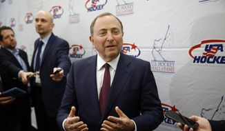 NHL Commissioner Gary Bettman speaks with members of the media before being inducted into the U.S. Hockey Hall of Fame in Washington, in this Thursday, Dec. 12, 2019, file photo. (AP Photo/Patrick Semansky, File)