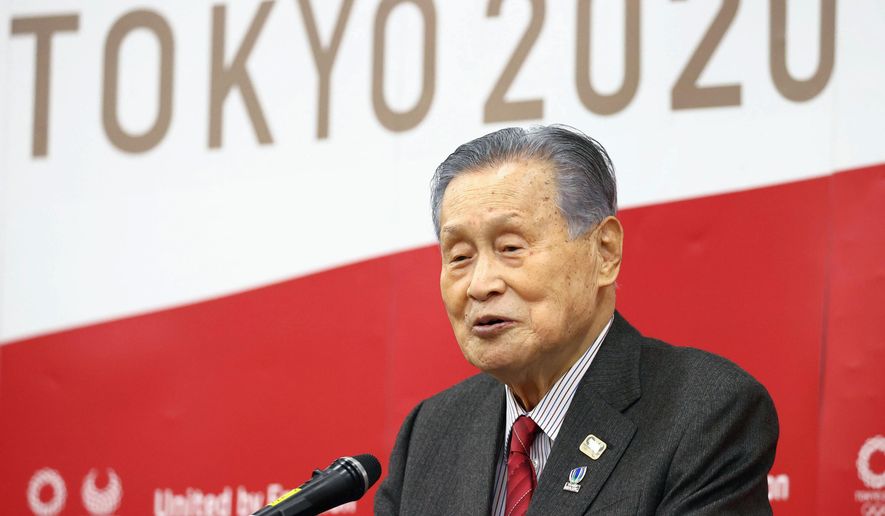 Tokyo 2020 Organizing Committee President Yoshiro Mori delivers a New Year&#39;s address in Tokyo Tuesday, Jan. 12, 2021.  Mori tried on Tuesday to reassure the public that the postponed games will open in just over six months. (Kyodo News via AP)