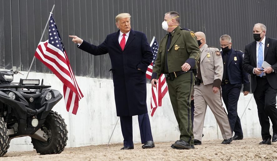 President Donald Trump tours a section of the U.S.-Mexico border wall under construction Tuesday, Jan. 12, 2021, in Alamo, Texas. (AP Photo/Alex Brandon)