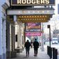 Pedestrians walk past closed Theatres, Sunday, Jan. 10, 2021, in the Hell&#39;s Kitchen neighborhood of New York.  (AP Photo/Mary Altaffer)  **FILE**