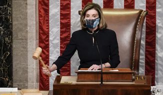 Speaker of the House Nancy Pelosi, D-Calif., gavels in the final vote of the impeachment of President Donald Trump, for his role in inciting an angry mob to storm the Congress last week, at the Capitol in Washington, Wednesday, Jan. 13, 2021. (AP Photo/J. Scott Applewhite)