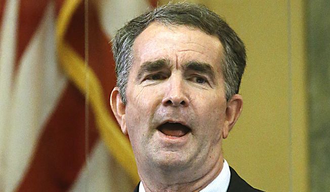 Gov. Ralph Northam delivers his State of the Commonwealth speech inside the State Capitol in Richmond, VA Wednesday, Jan. 13, 2021. Members watched virtually due to COVID-19 restrictions. (Bob Brown/Richmond Times-Dispatch via AP) **FILE**